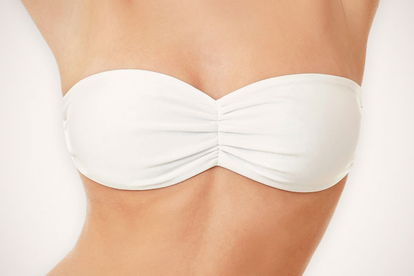 Washington DC Breast Implant Replacement model wearing white